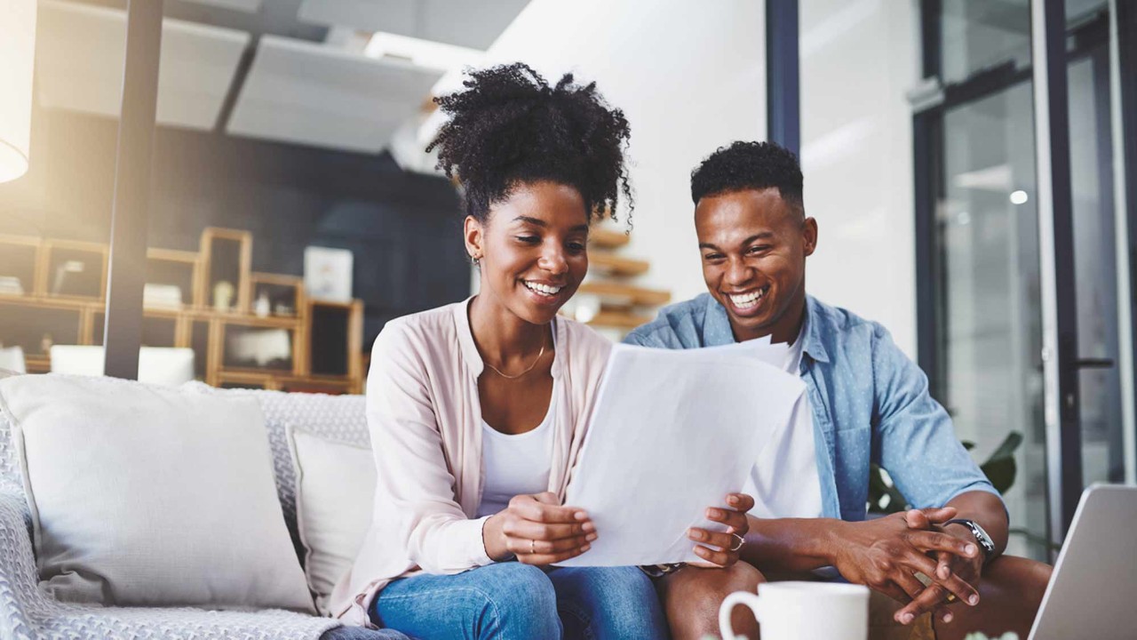a couple looking at papers
